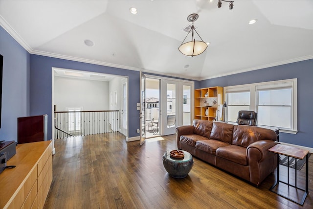 living area with vaulted ceiling, ornamental molding, and hardwood / wood-style flooring