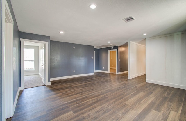 unfurnished room with dark hardwood / wood-style floors