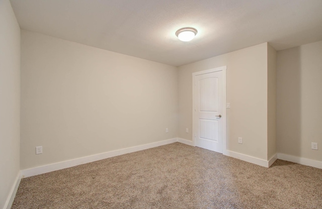 empty room featuring carpet floors