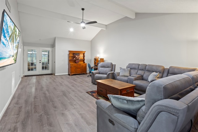 living area with a ceiling fan, french doors, light wood-style floors, baseboards, and vaulted ceiling with beams