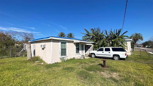 view of home's exterior with a lawn