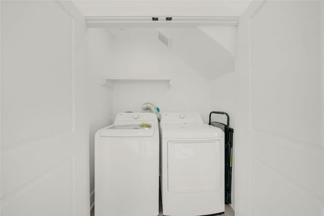 laundry area with separate washer and dryer