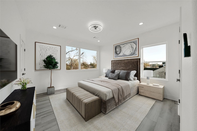 bedroom with light hardwood / wood-style floors