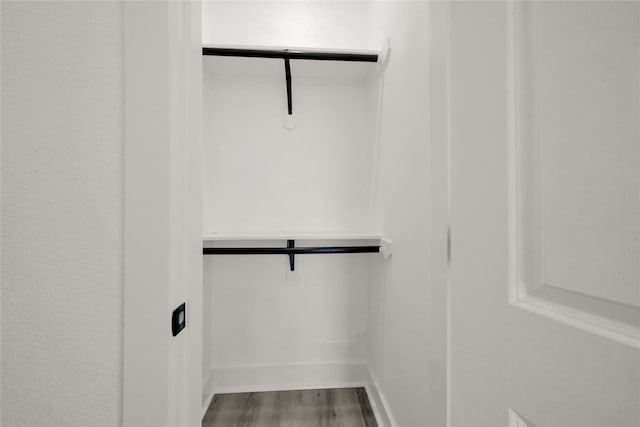 walk in closet featuring hardwood / wood-style floors