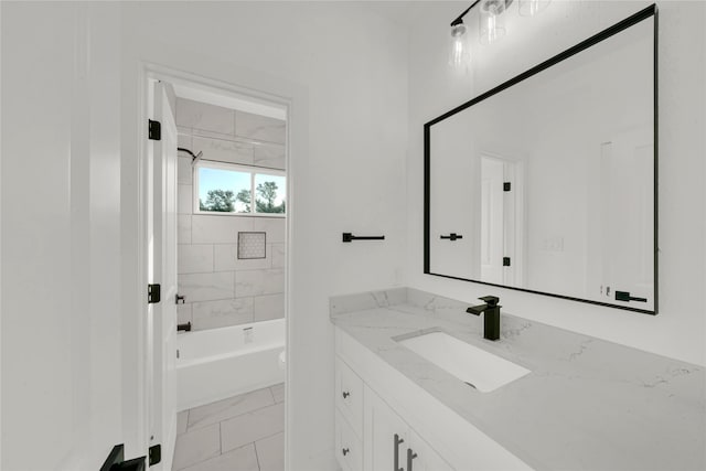 full bathroom featuring tiled shower / bath combo, vanity, and toilet