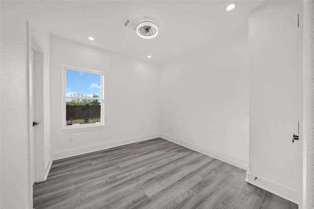 empty room with hardwood / wood-style floors