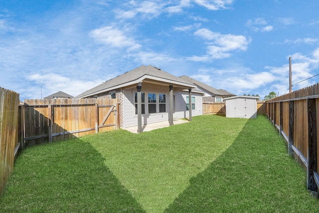 back of house with a storage unit and a lawn