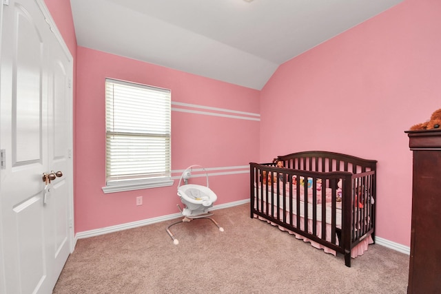 bedroom featuring carpet flooring, lofted ceiling, and baseboards