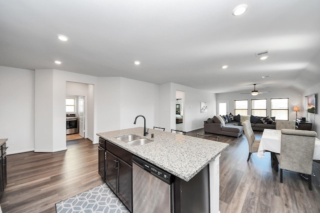 kitchen with light stone countertops, a sink, ceiling fan, dark wood-type flooring, and stainless steel dishwasher