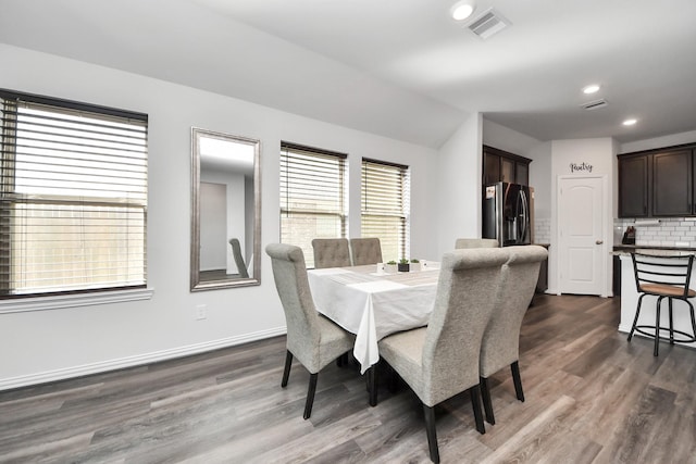 dining space featuring recessed lighting, dark wood finished floors, visible vents, and baseboards