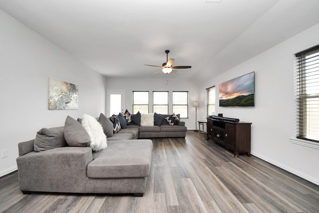 living room with hardwood / wood-style flooring and ceiling fan