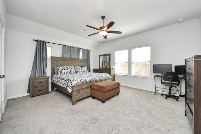 bedroom with vaulted ceiling, ceiling fan, and light colored carpet