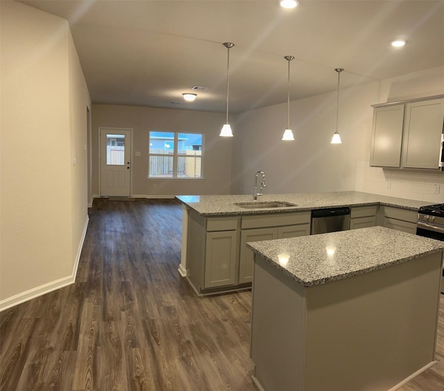 kitchen with light stone counters, sink, gray cabinets, and stainless steel appliances