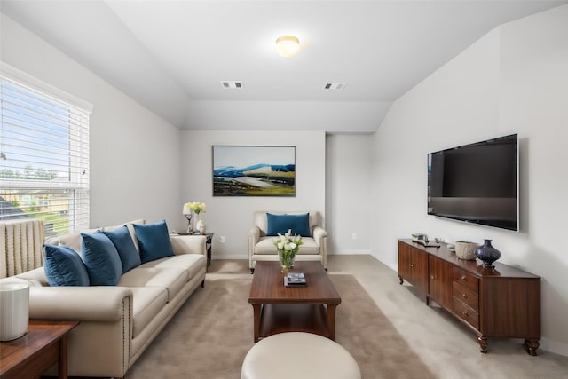 living room with light carpet and lofted ceiling