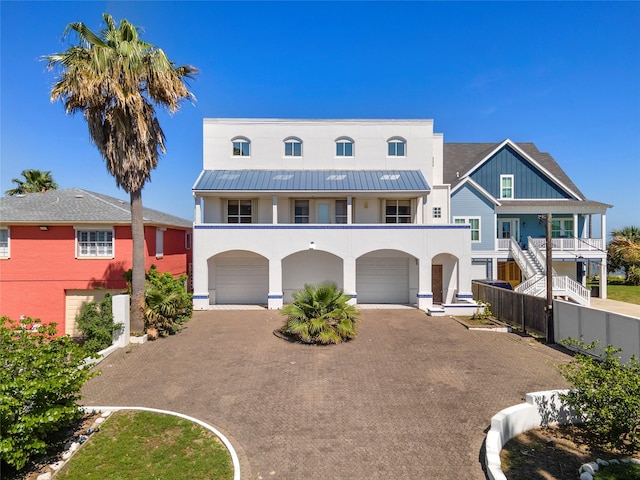 view of front of house with a garage and a balcony