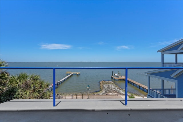 balcony featuring a water view