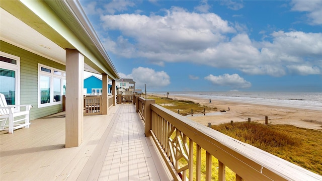 balcony with a view of the beach and a water view