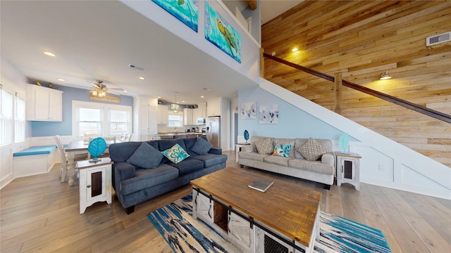 living room with ceiling fan and hardwood / wood-style floors