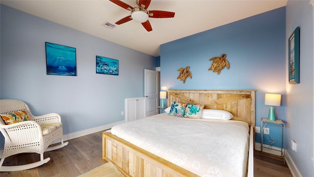 bedroom featuring ceiling fan and wood-type flooring