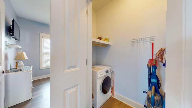 washroom featuring hardwood / wood-style flooring and washer / clothes dryer