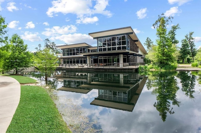 rear view of property featuring a water view