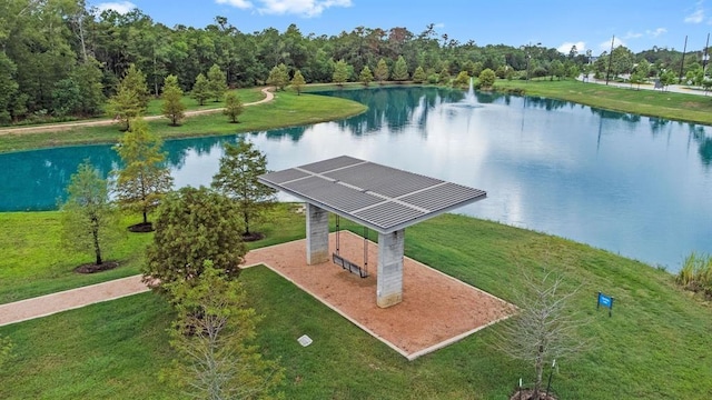 birds eye view of property with a water view