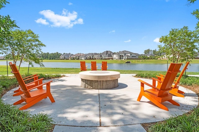 view of patio / terrace featuring a water view and an outdoor fire pit