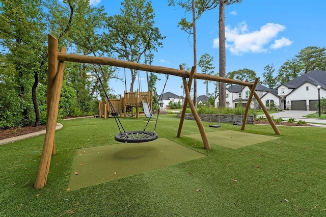 view of playground with a residential view and a yard