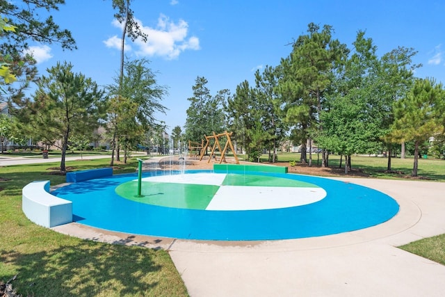 view of home's community with a yard and a playground