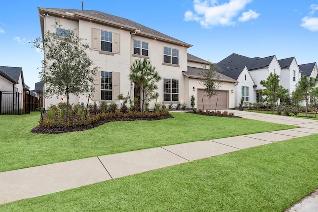 view of front facade featuring a garage and a front lawn