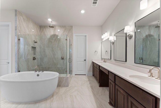 full bath featuring double vanity, a stall shower, visible vents, and a sink