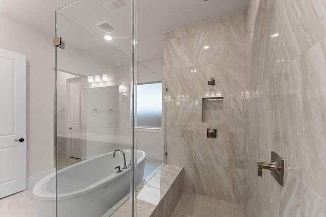 full bath with a soaking tub, visible vents, and a tile shower