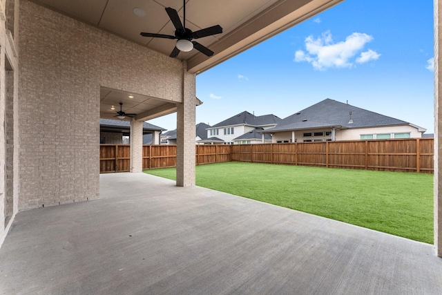 view of patio featuring ceiling fan and a fenced backyard