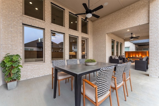 view of patio / terrace with an outdoor living space and ceiling fan