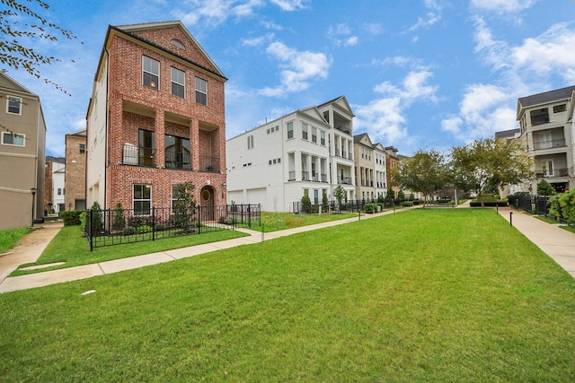 view of home's community with a lawn