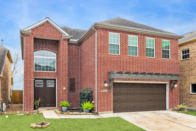 view of front of house featuring a garage and a front lawn