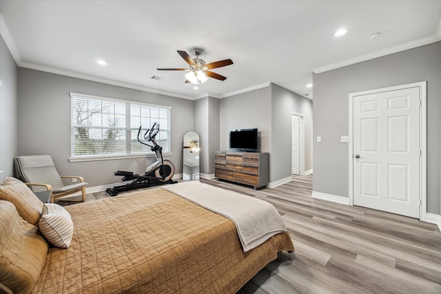 bedroom with ceiling fan, light wood-type flooring, and crown molding