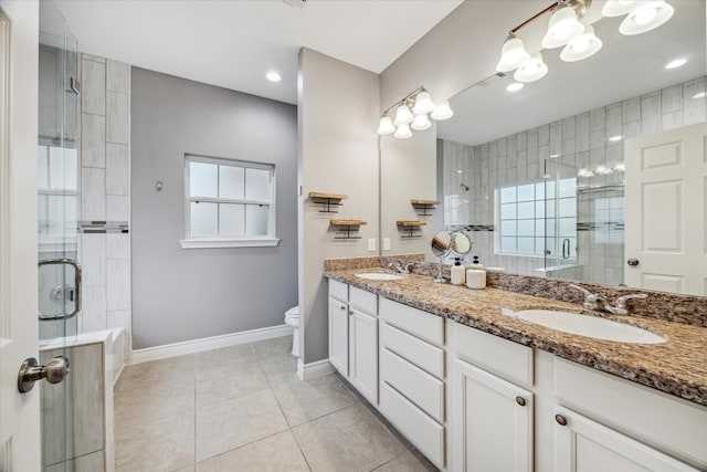 bathroom with toilet, tile patterned flooring, an enclosed shower, and vanity