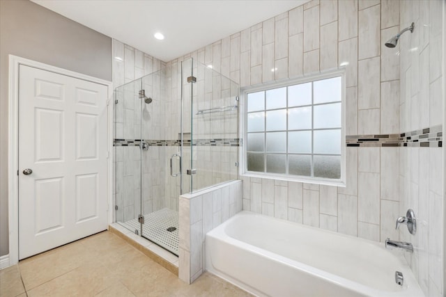 bathroom featuring tile patterned floors and plus walk in shower