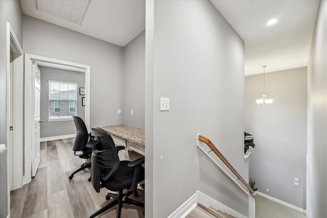 office area featuring a notable chandelier and light hardwood / wood-style flooring