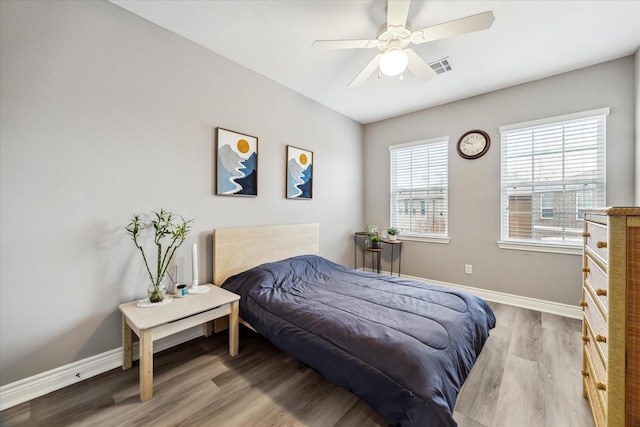 bedroom featuring ceiling fan and light hardwood / wood-style floors