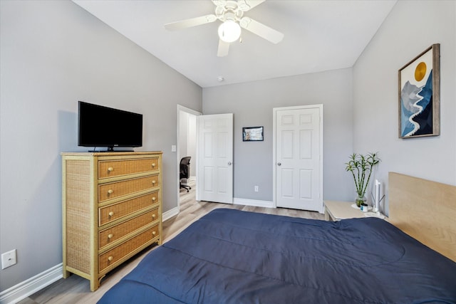 bedroom featuring ceiling fan and hardwood / wood-style flooring