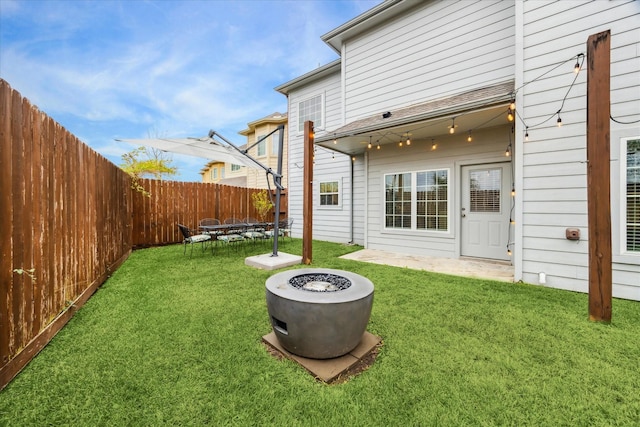 view of yard with an outdoor fire pit