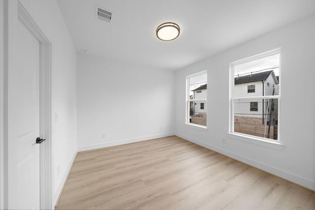 unfurnished room featuring light wood-type flooring