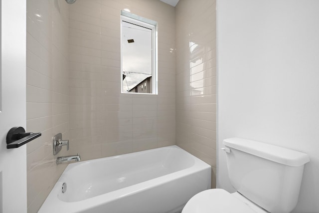 bathroom featuring toilet and shower / tub combination