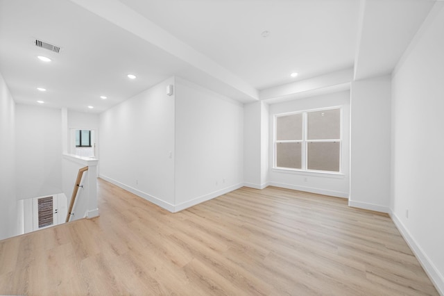 unfurnished room with light hardwood / wood-style floors