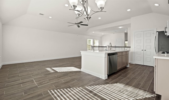 kitchen with visible vents, vaulted ceiling, open floor plan, appliances with stainless steel finishes, and wood tiled floor