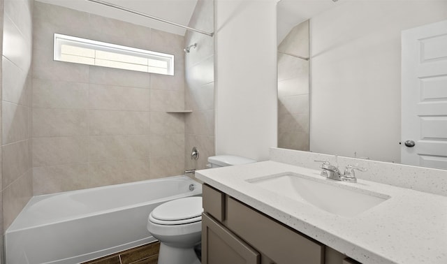 bathroom featuring wood finished floors, shower / bathing tub combination, vanity, and toilet