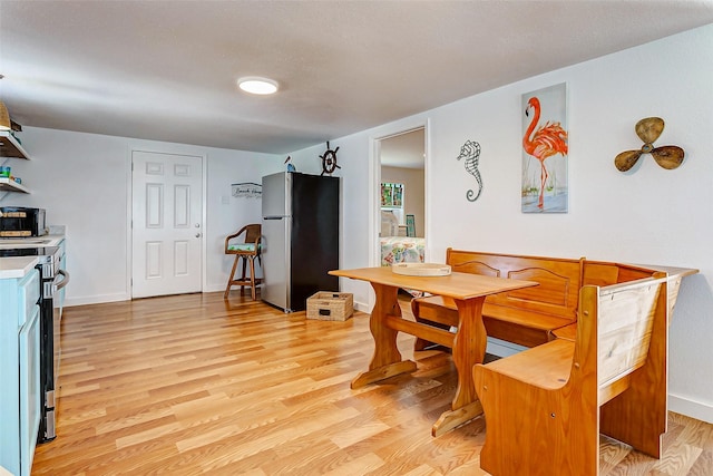 dining room featuring light wood-type flooring