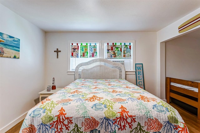 bedroom with hardwood / wood-style floors